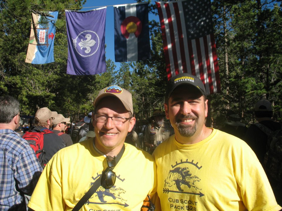 Scott Donze with troop flag - Today is a day to honor the Boy Scouts of America