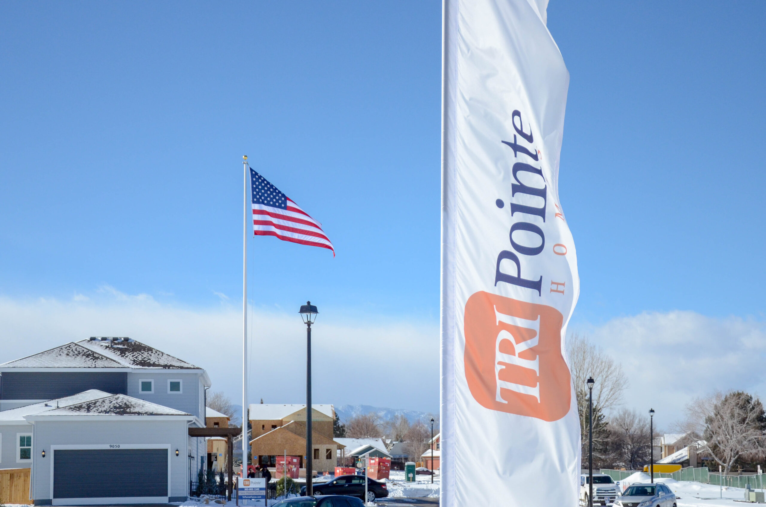 Custom Flag Company Tri Pointe Custom Feather Flag & US Flag in new community