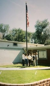 Custom Flag company building in 2004 installing flagpole
