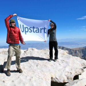 Hikers displaying Upstart custom flag