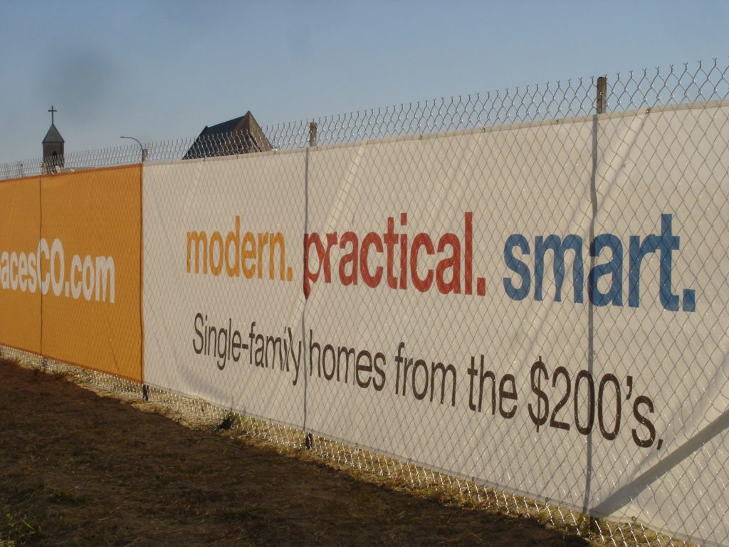 Shea Spaces vinyl banner on a fence - exposure. banners can help