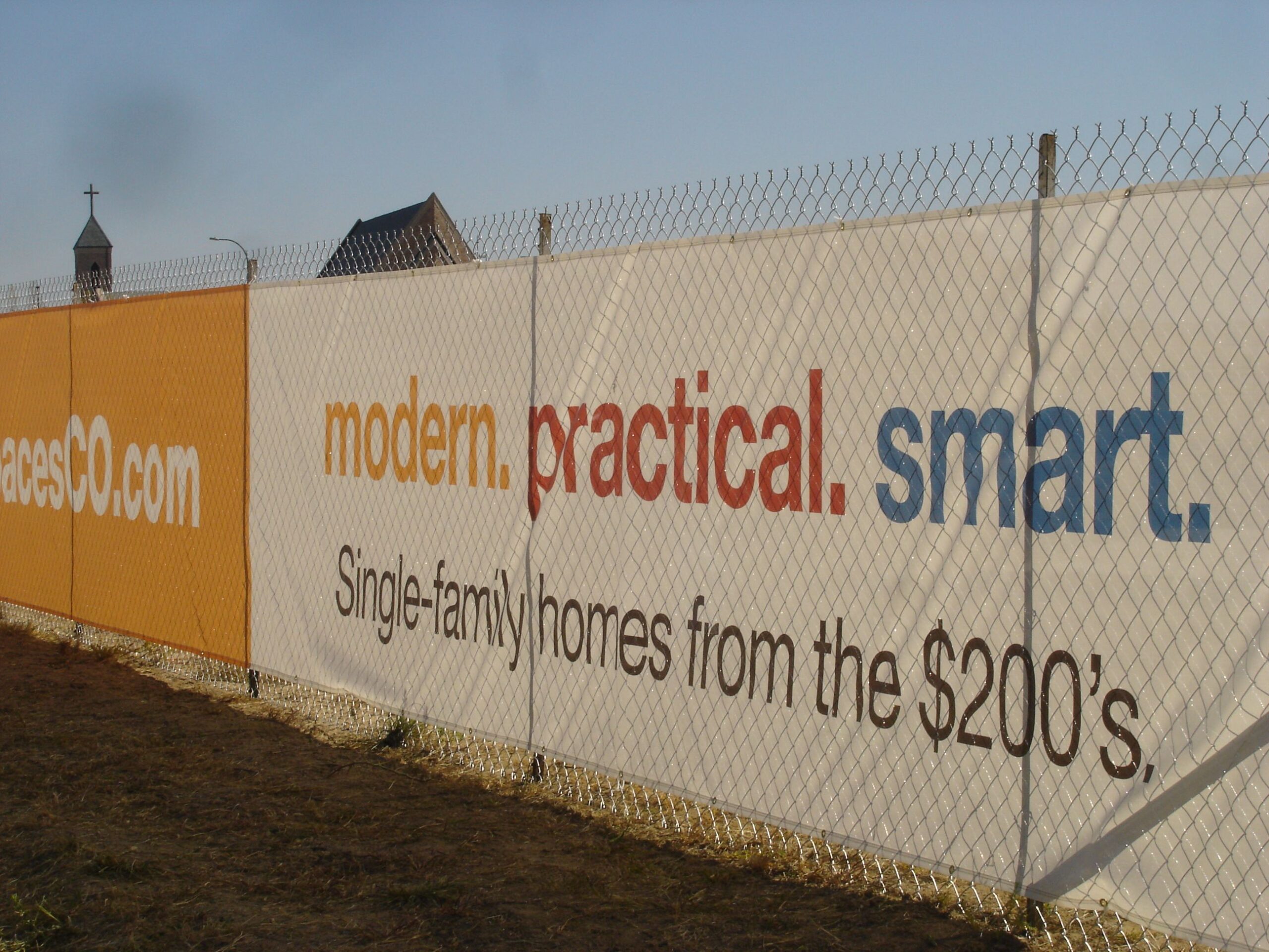 Shea Spaces vinyl banner on a fence